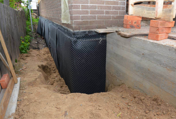 SJ Waterproofing Pros technician performing targeted Exterior Waterproofing assessment in Medford, MN
